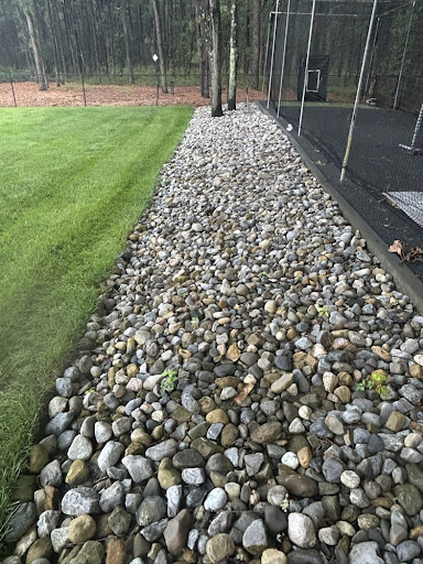 Decorative River Rock and Stone Bed Installation